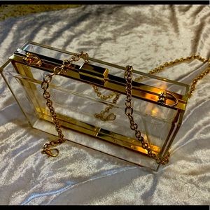 NWOT clear clutch/purse with gold accent/chain